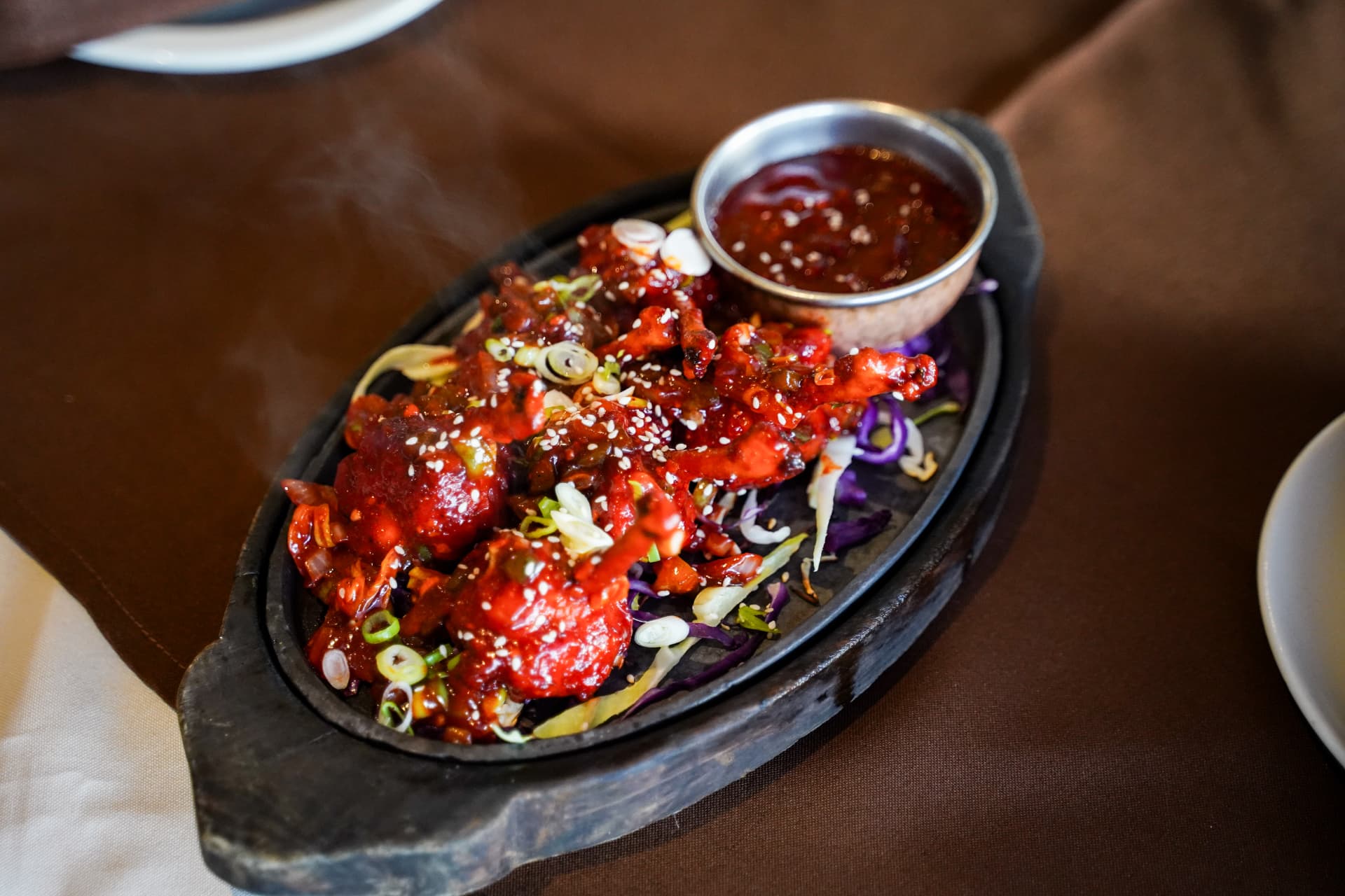 Sizzling Indian starter served on a cast iron platter